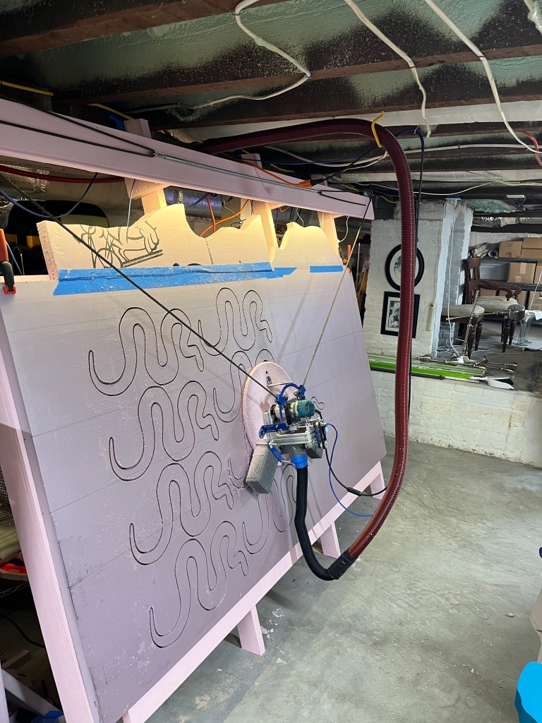 CNC machine cutting out some snakes.